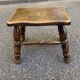 Small vintage low stool made of turned solid wood footrest 1960
