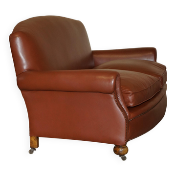 Edwardian leather club canapé circa 1910 with feather cushions.
