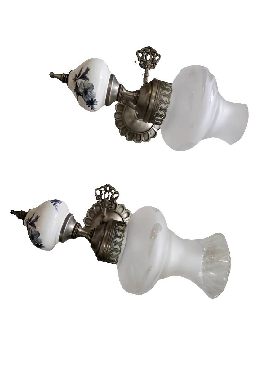 Pair of vintage wall sconces in brass, porcelain, and frosted glass.