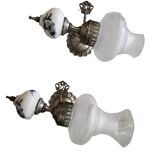 Pair of vintage wall sconces in brass, porcelain, and frosted glass.