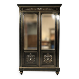 Napoleon III bookcase, blackened wood inlaid with brass, ivory and mother-of-pearl