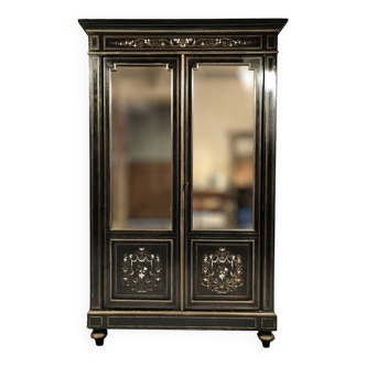 Napoleon III bookcase, blackened wood inlaid with brass, ivory and mother-of-pearl