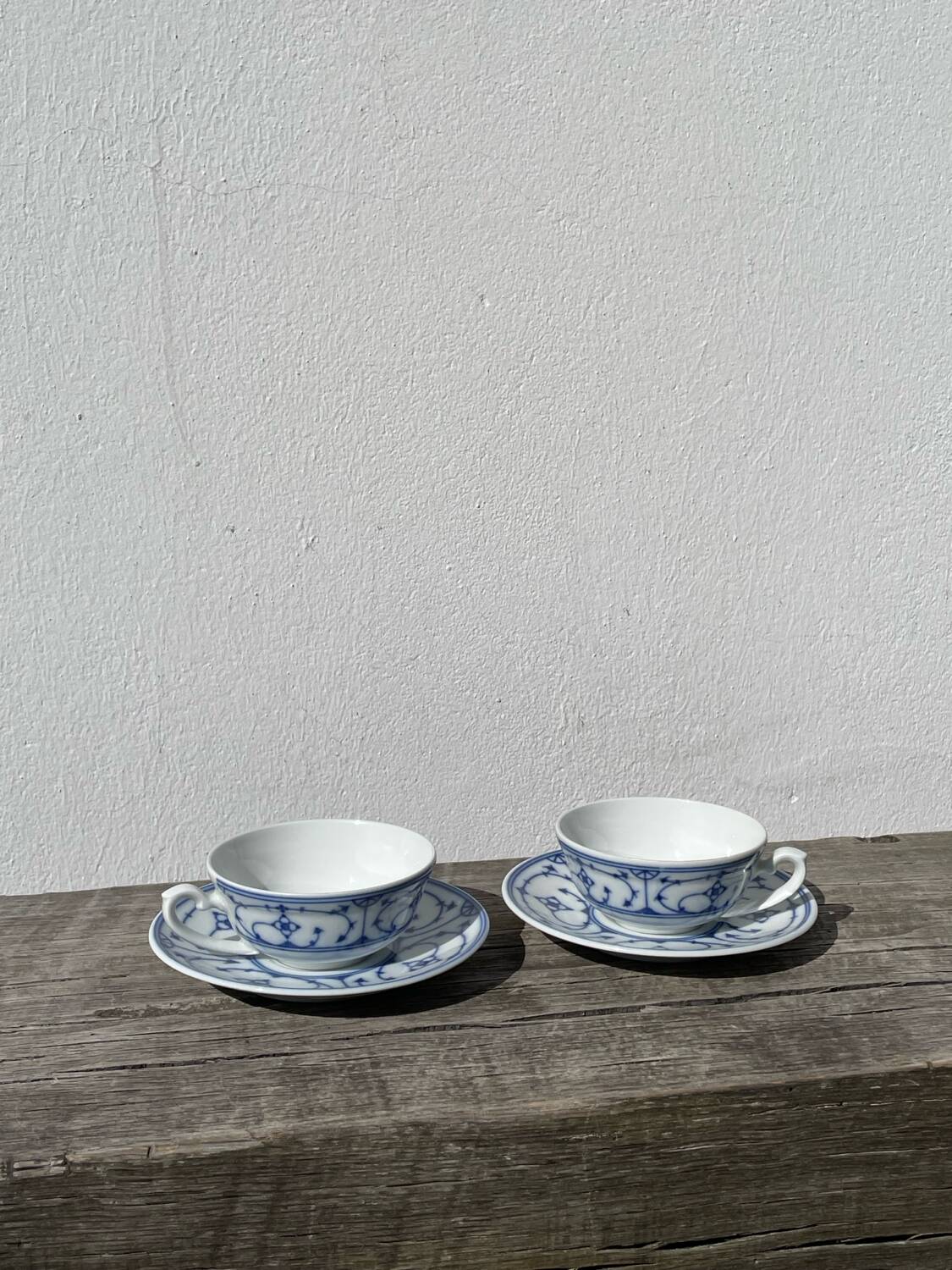 Pair of signed blue porcelain cups