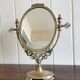 Oval mirror on psyche stand