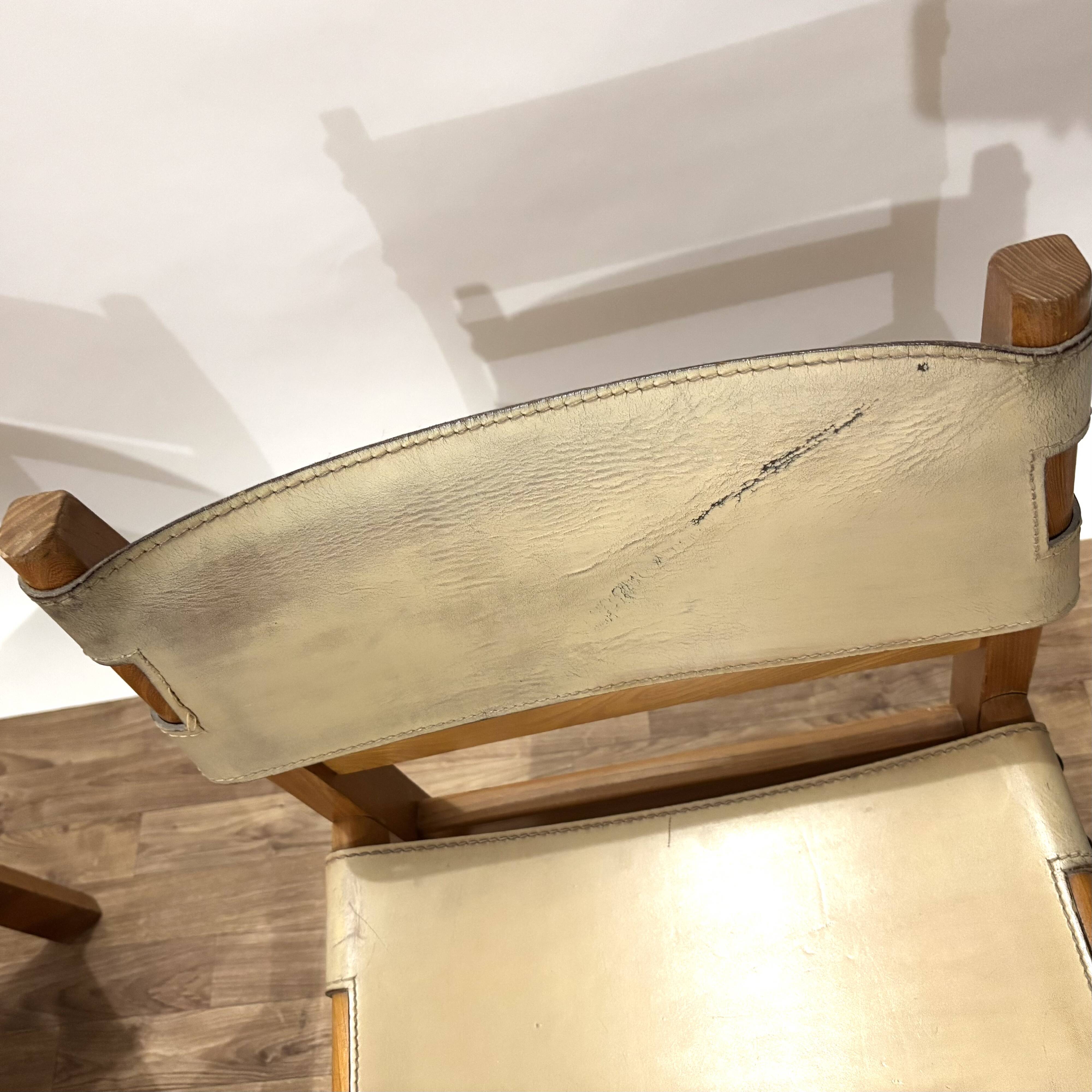 Pair of Maison Regain leather chairs