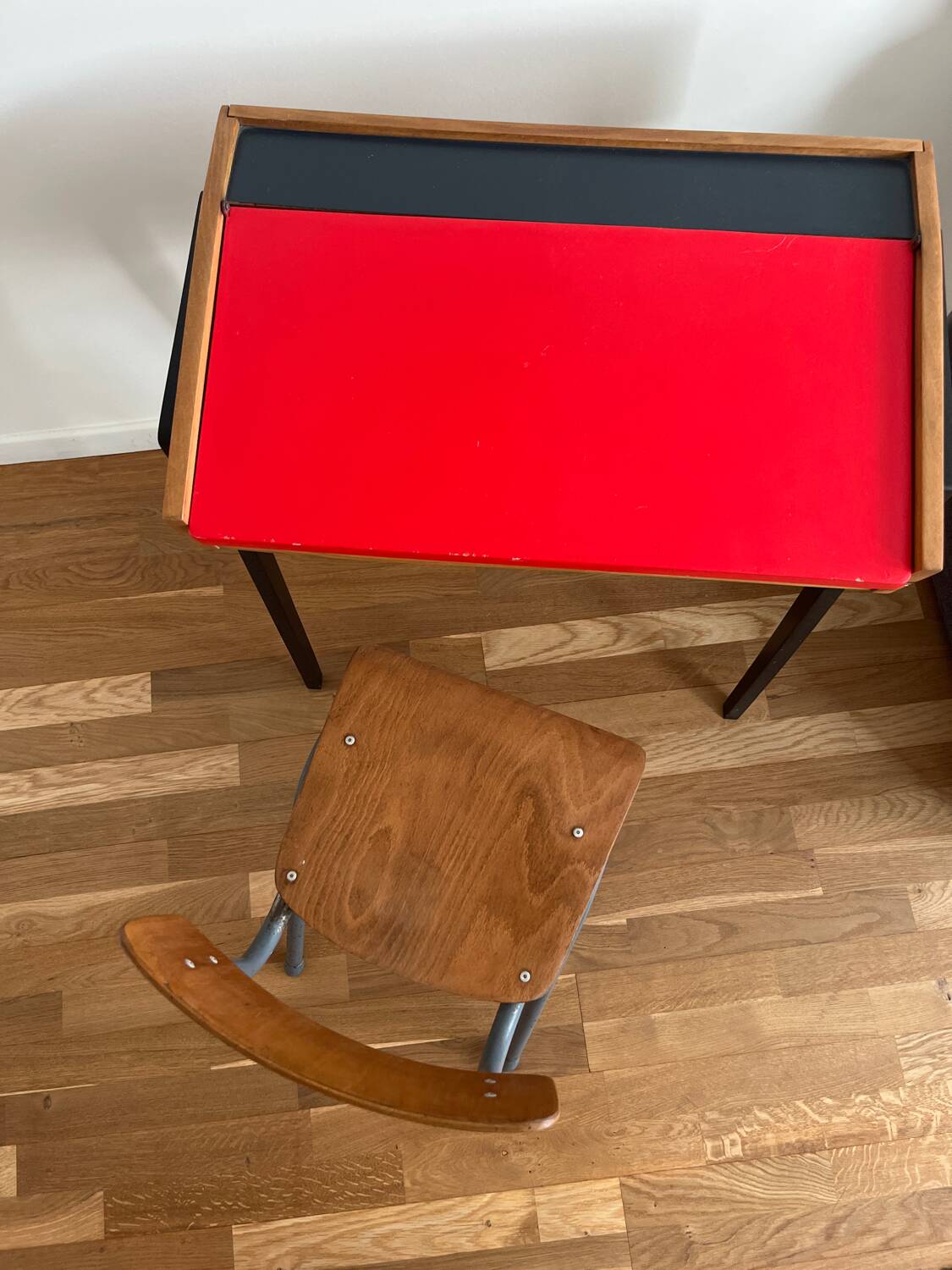 Vintage 1960s school desk with a red Formica top.