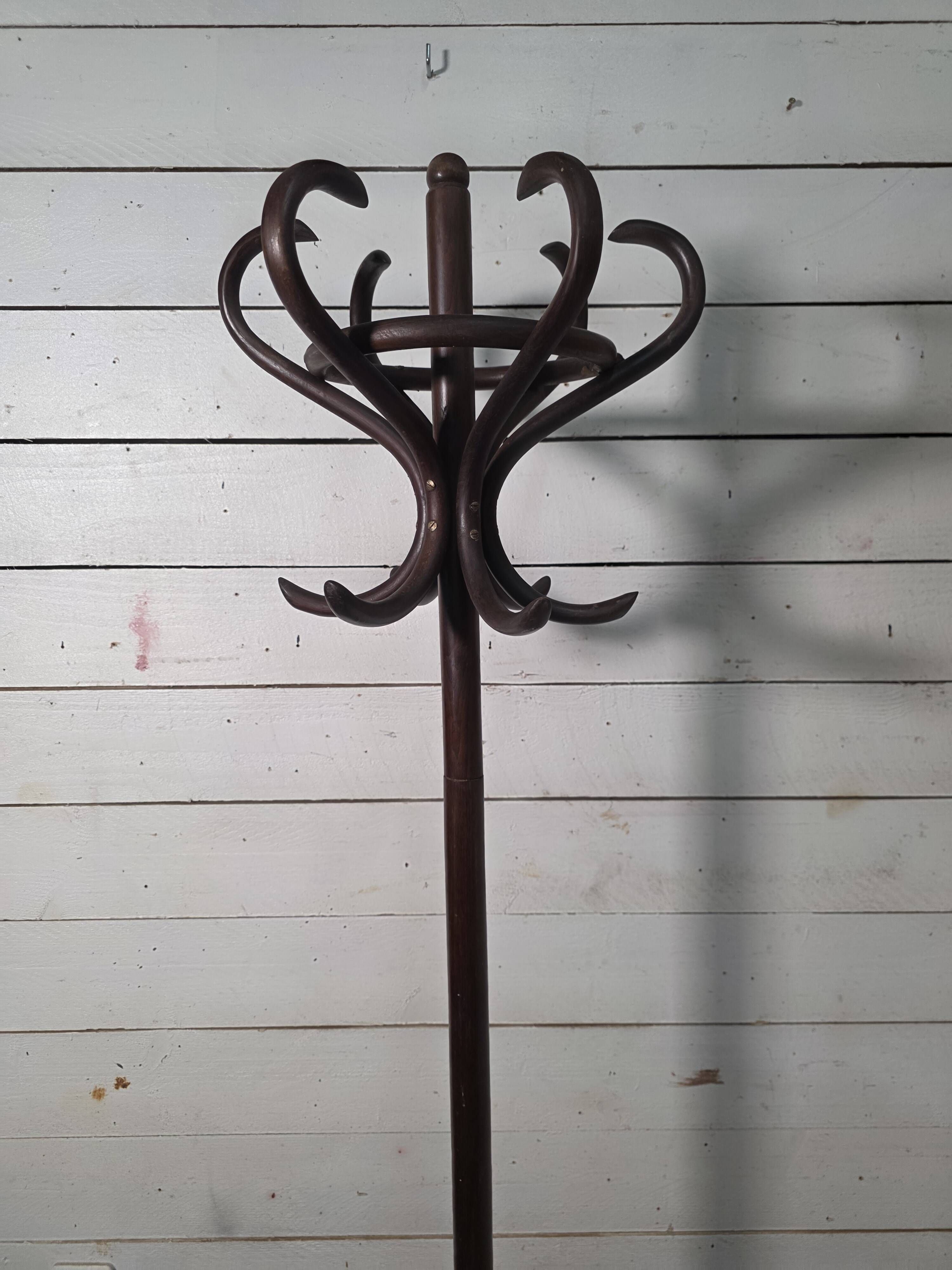 Curved antique wooden parrot