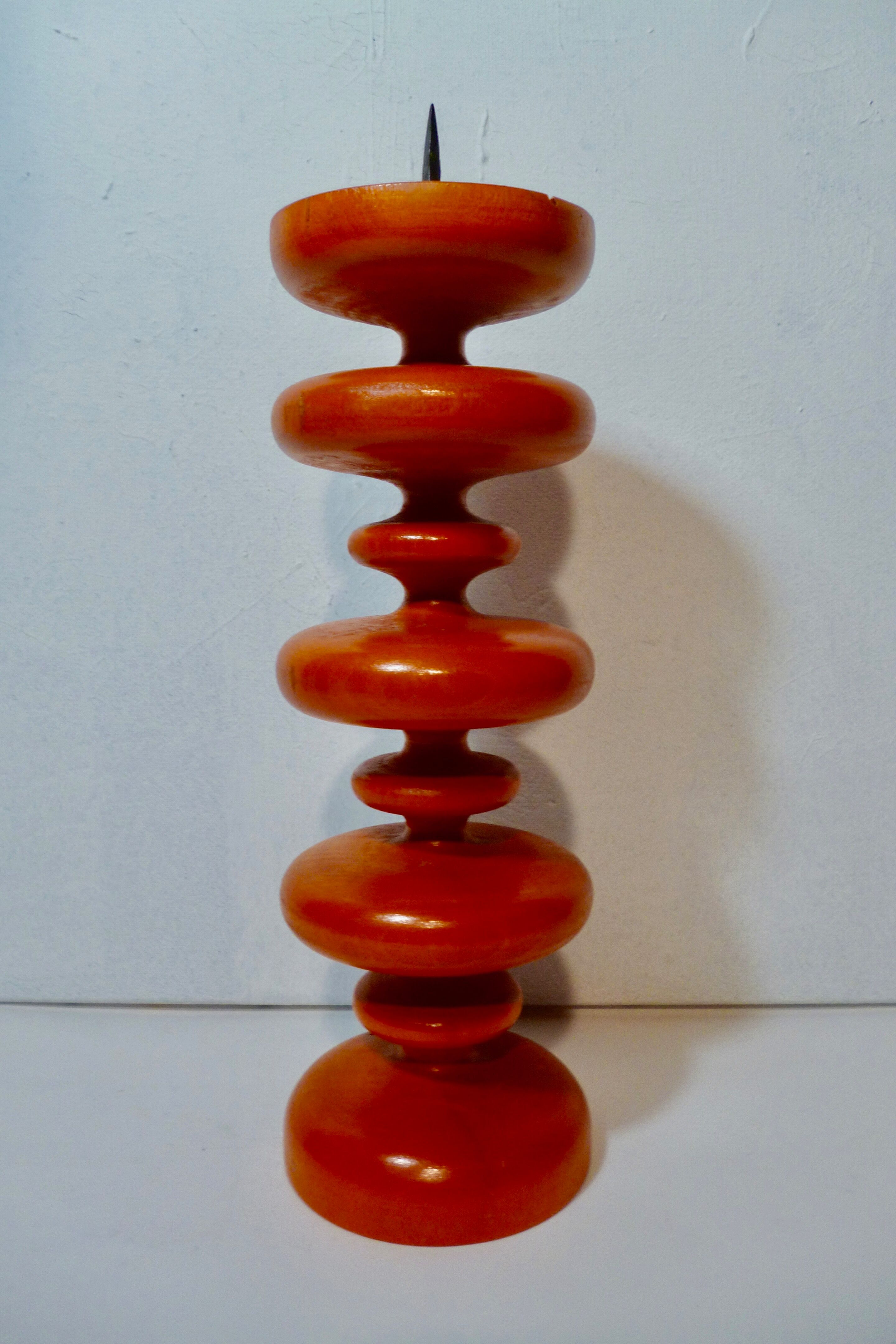 Vintage wooden candlestick turned orange