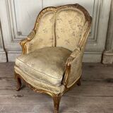 A Louis XV style child's bergère chair in carved and gilded wood, circa 1880