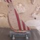 Wooden and metal hook in the shape of a sailboat