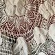 White cotton tablecloth with crochet lace.