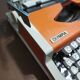 Olympia traveler de luxe orange typewriter serviced and new ribbon