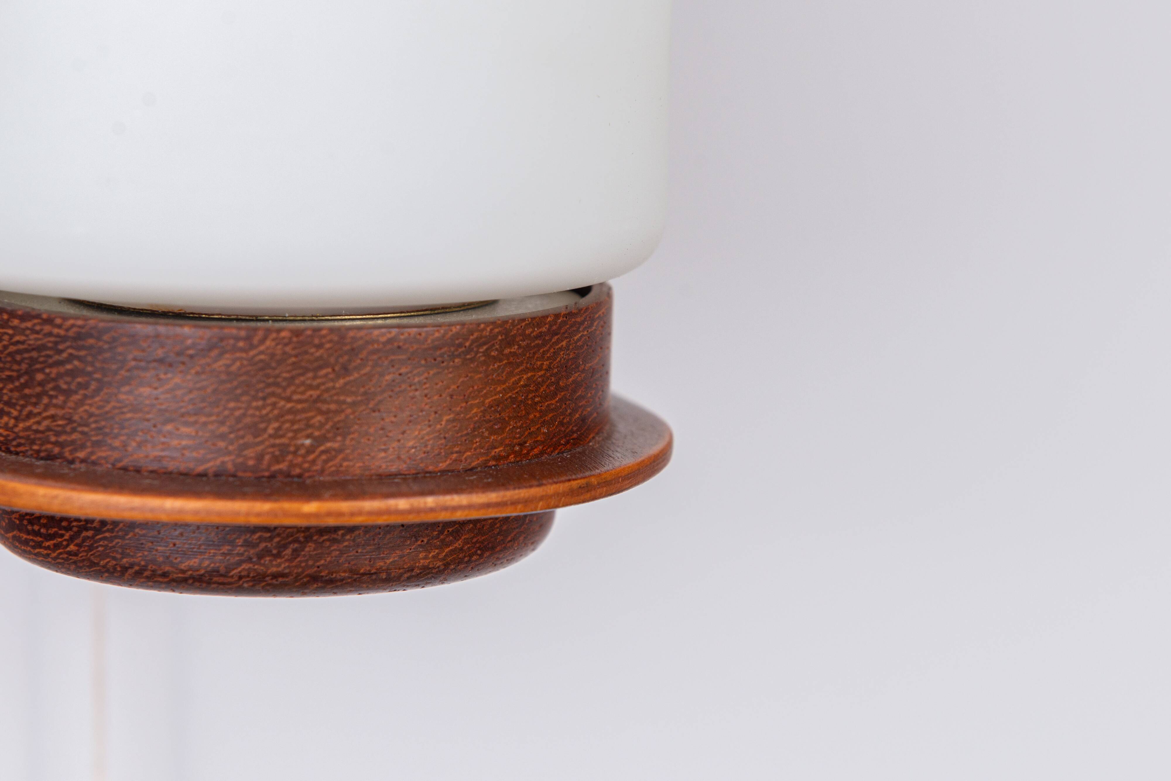 Cilindrical opal glass and bent wood wall lamp