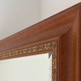 Large bevelled tabletop mirror in carved gilded wood.