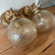 Pair of vintage wall sconces with golden metal swan heads and glass.