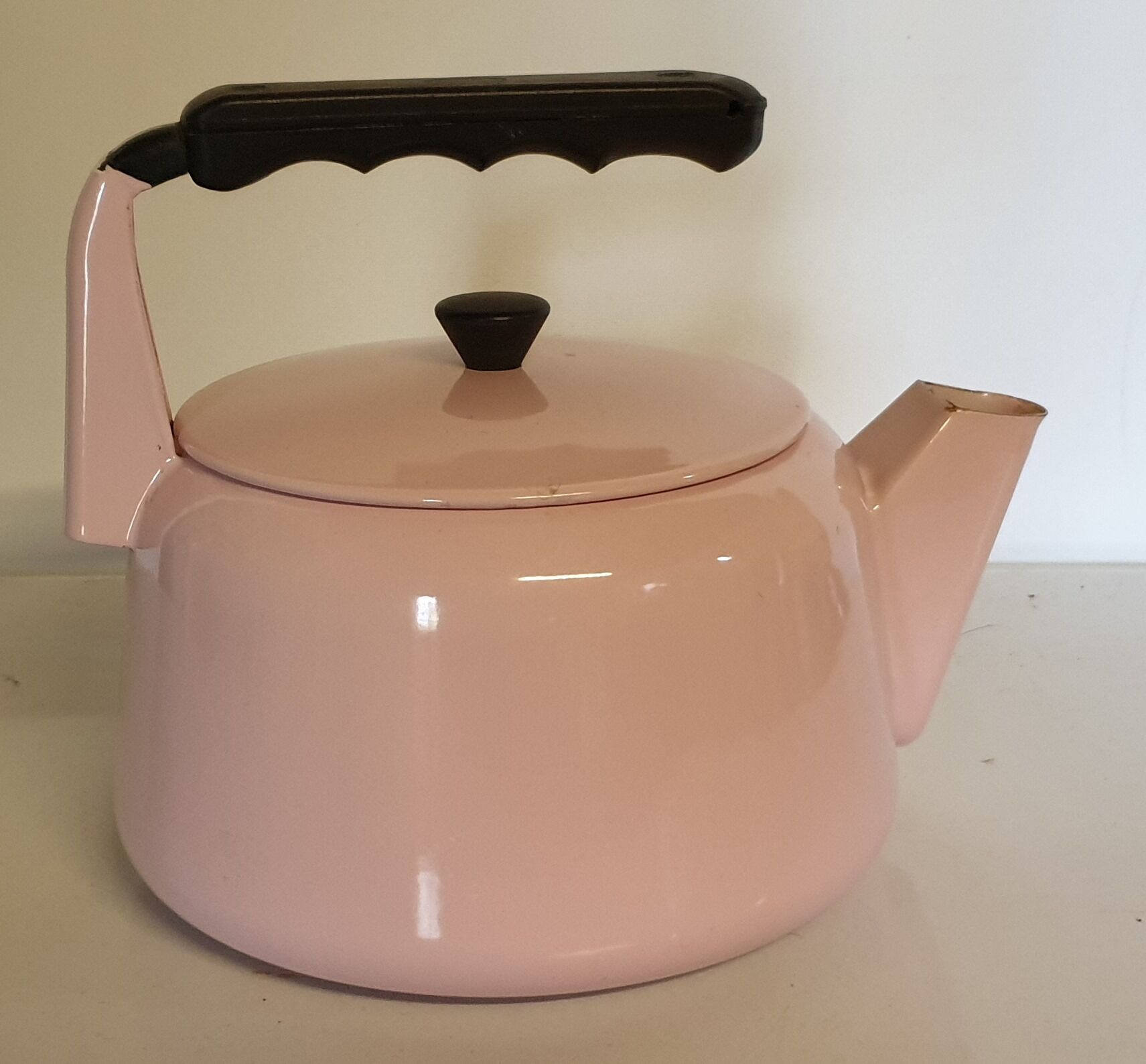 Pink enamelled tin kettle