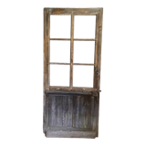 Old glazed wooden door patinated