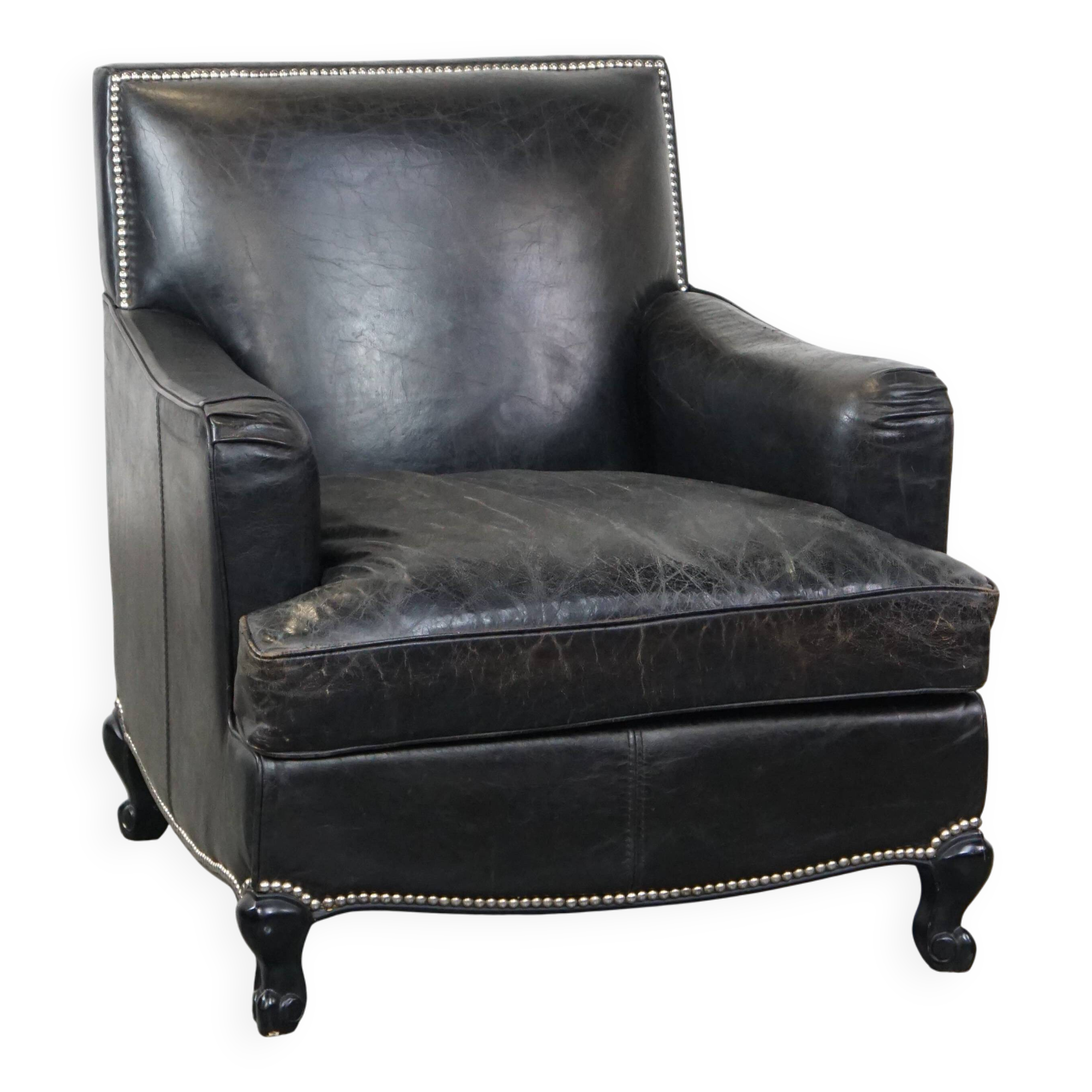 Armchair in black grained cowhide leather with a deep seat
