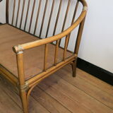 Two-seater rattan sofa with natural tones