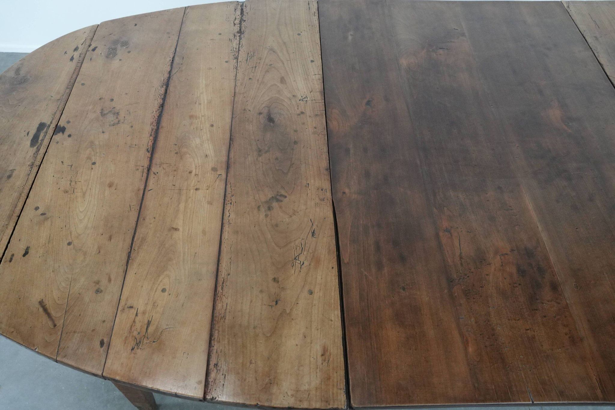 Rare antique oval French extendable dining table made of fruitwood