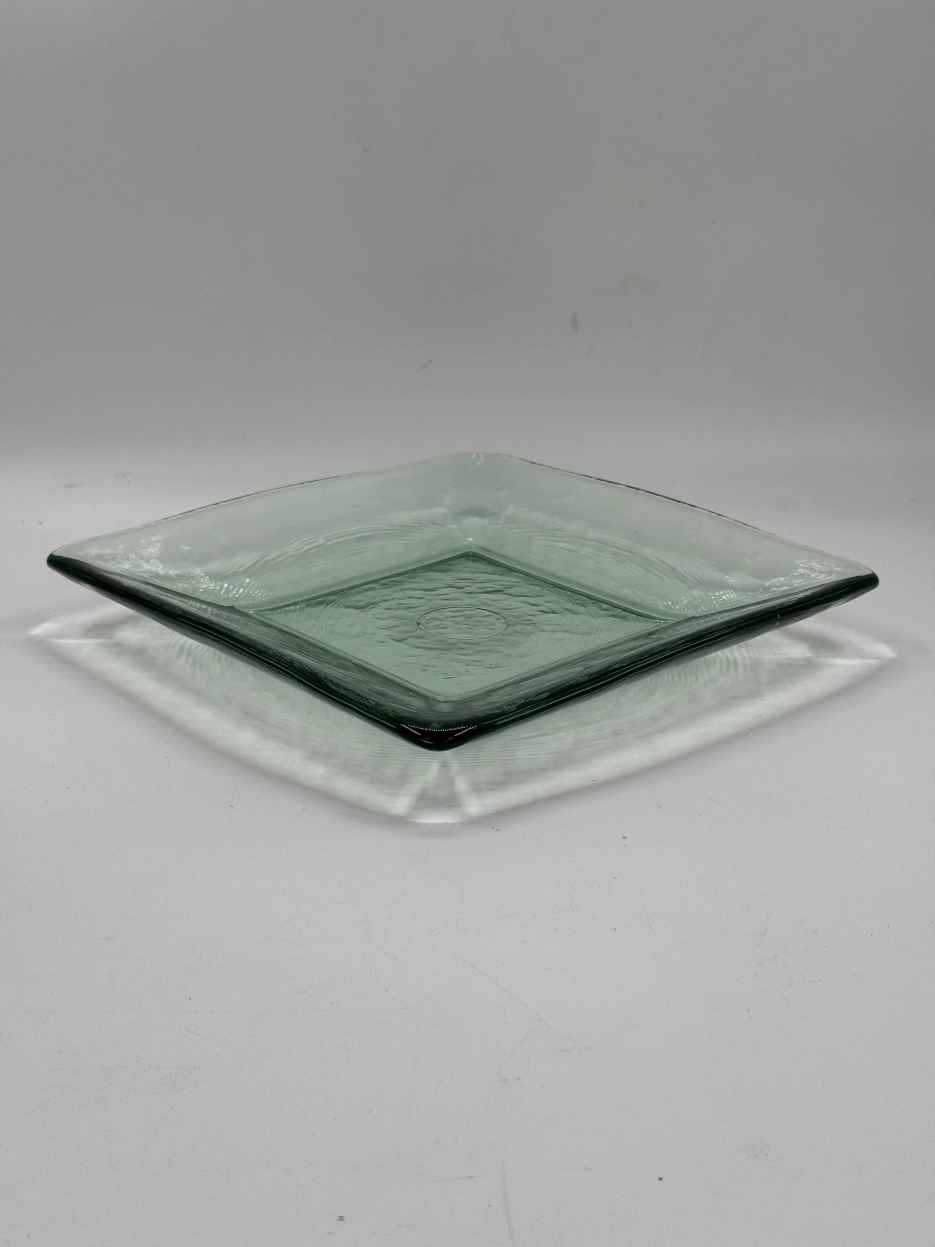 Square sculptural glass plate, textured wavy finish.