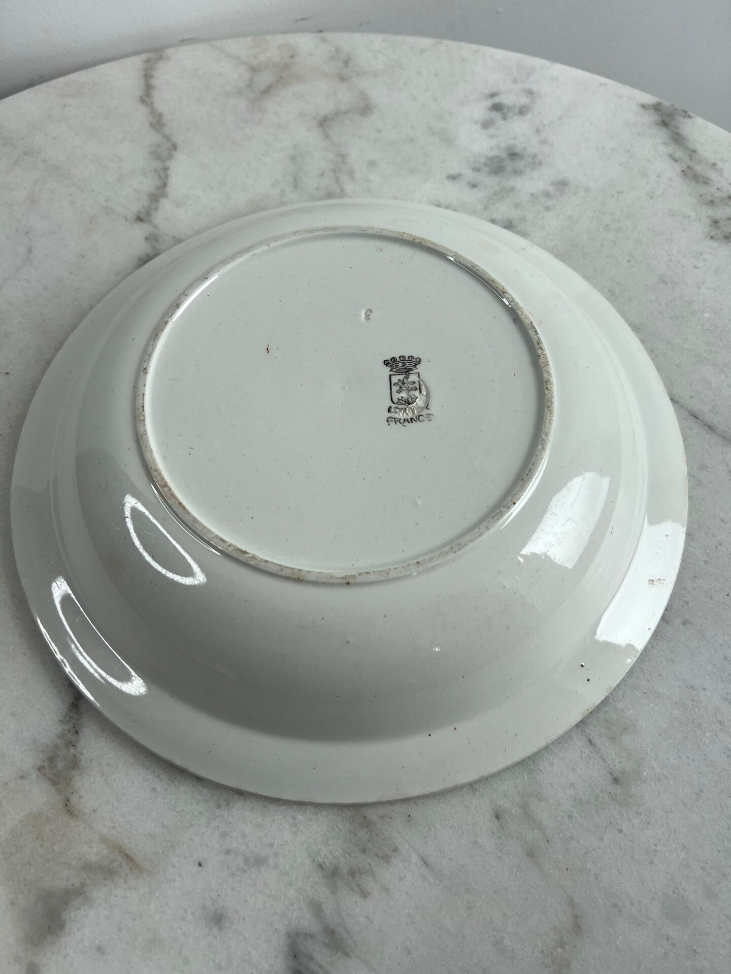 Longwy salad bowl with blue and orange floral decoration.