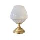 Antique white opaline glass globe table lamp with a brass base.