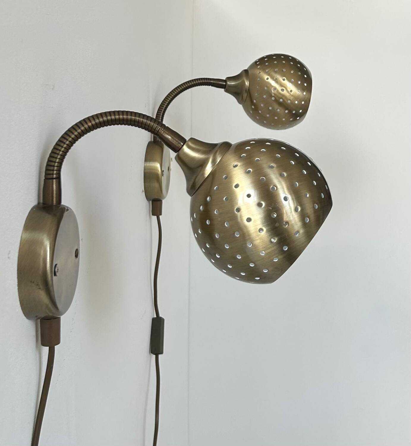 Pair of vintage adjustable wall lights, perforated brass, Sweden 1960