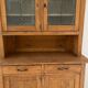 Antique dresser with glass doors and fleur-de-lys from the 50s