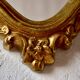 Large rococo mirror in gold painted wood