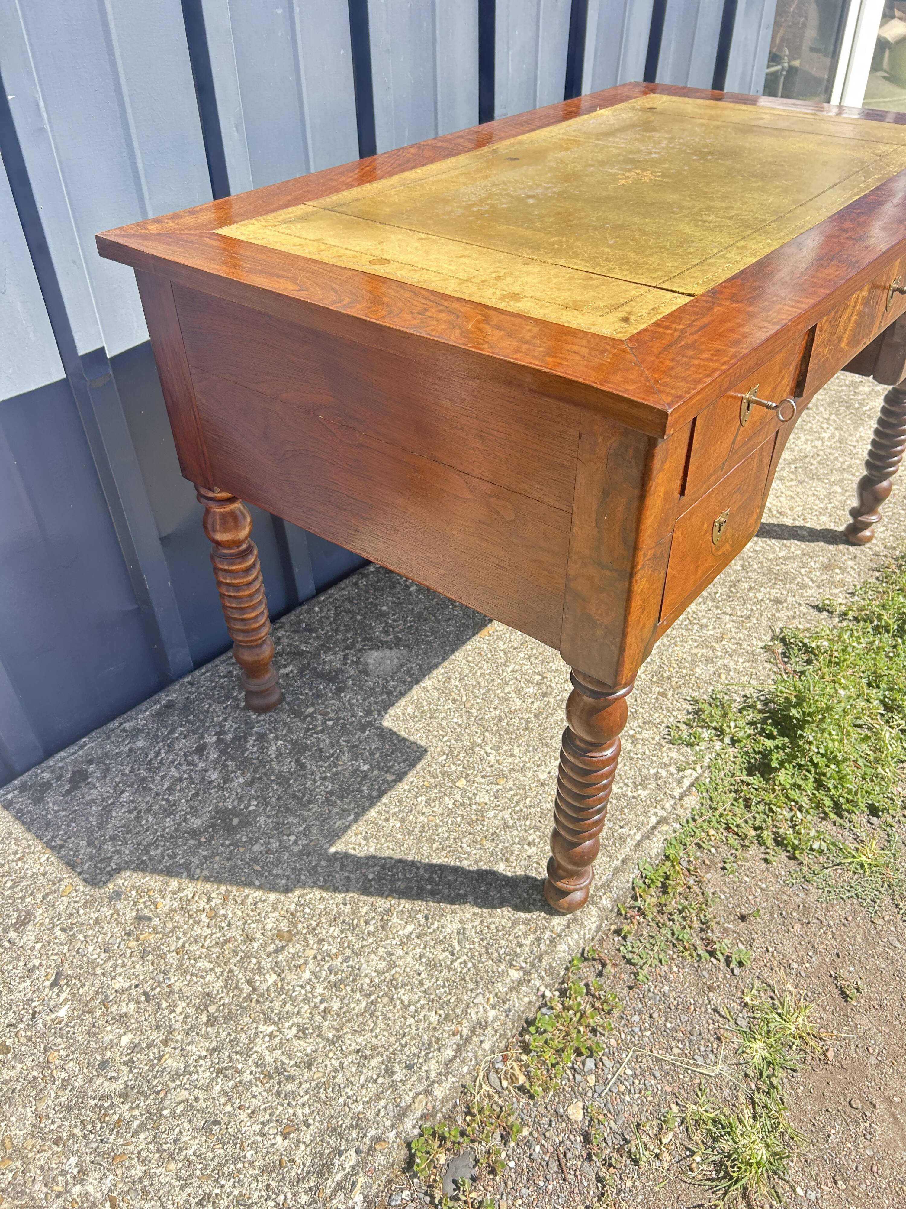 Louis Philippe desk in walnut, with a leather top.