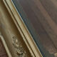 Large antique baroque mirror with angel decorations.