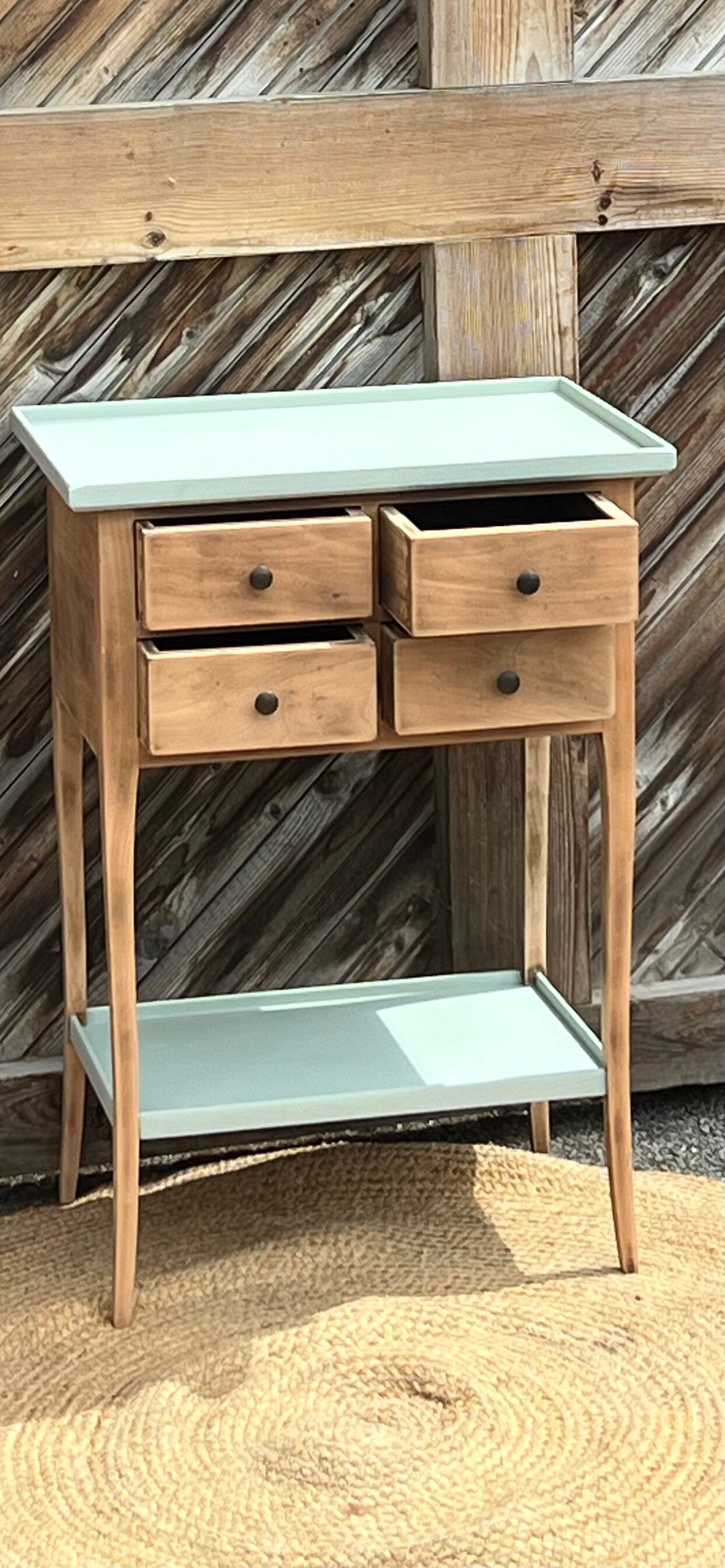 Raw wood console in water green with 4 drawers.