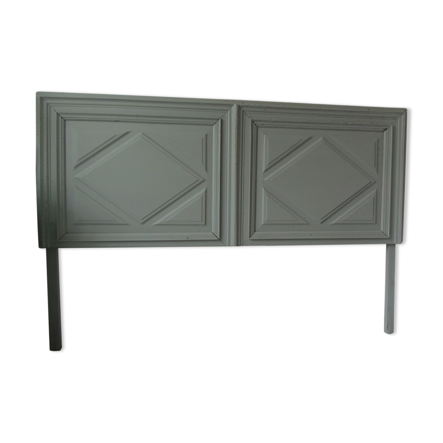 Headboard made with an old walnut door, re-enchanted in gray green waxed finish,