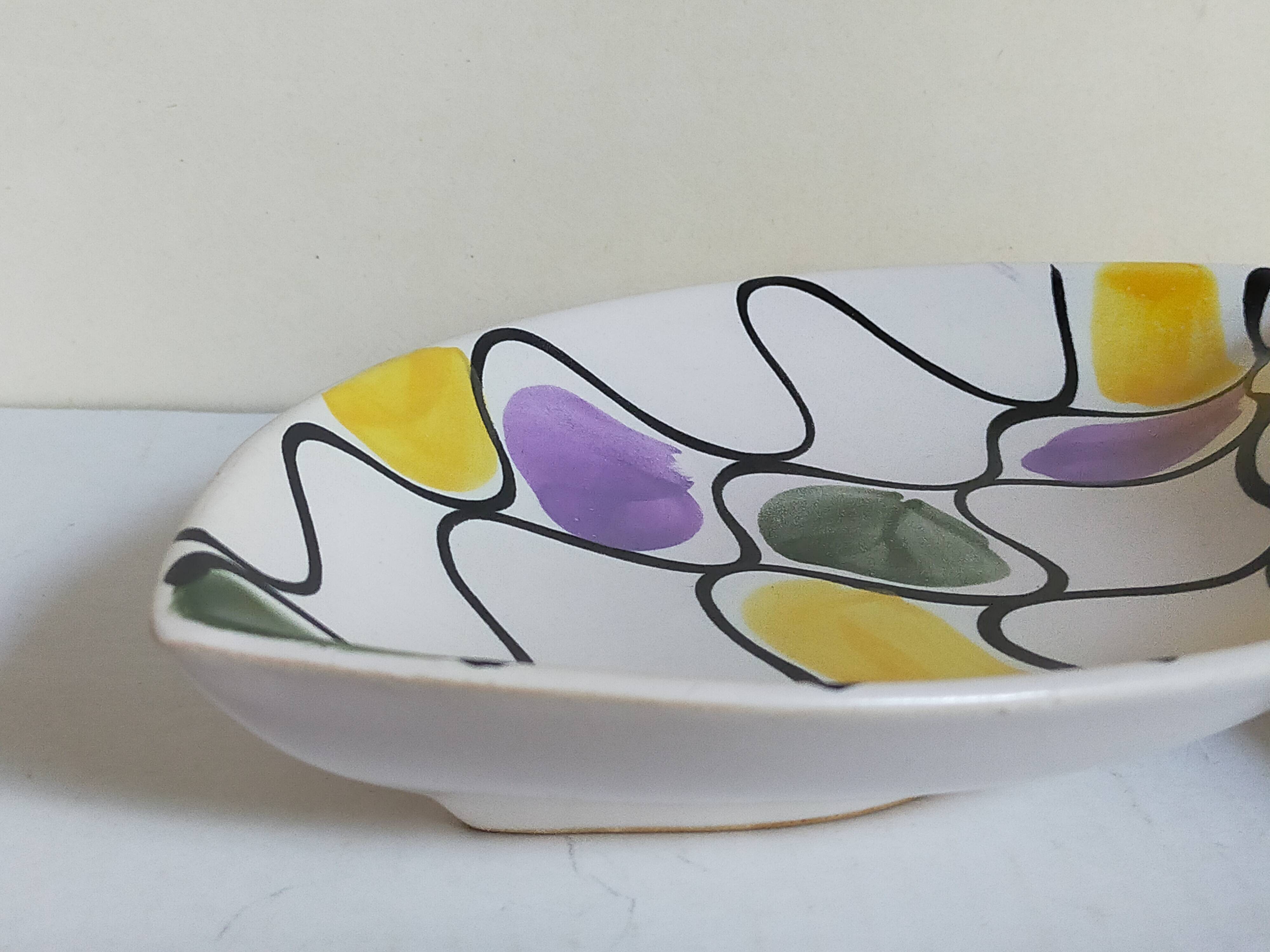Three vintage free-form ceramic ravine dishes from the 1950s