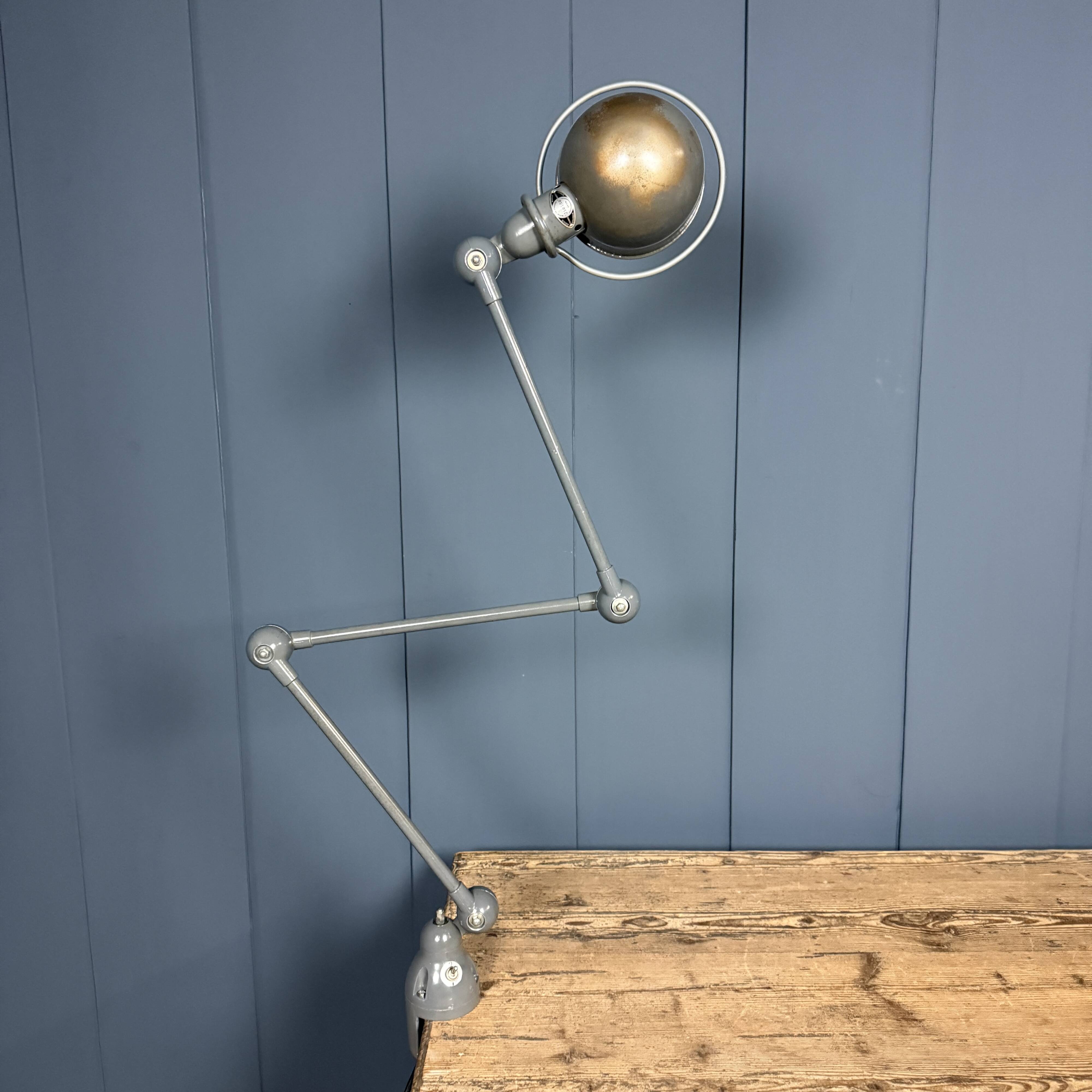 Dark grey Jielde three-arm clamp table lamp