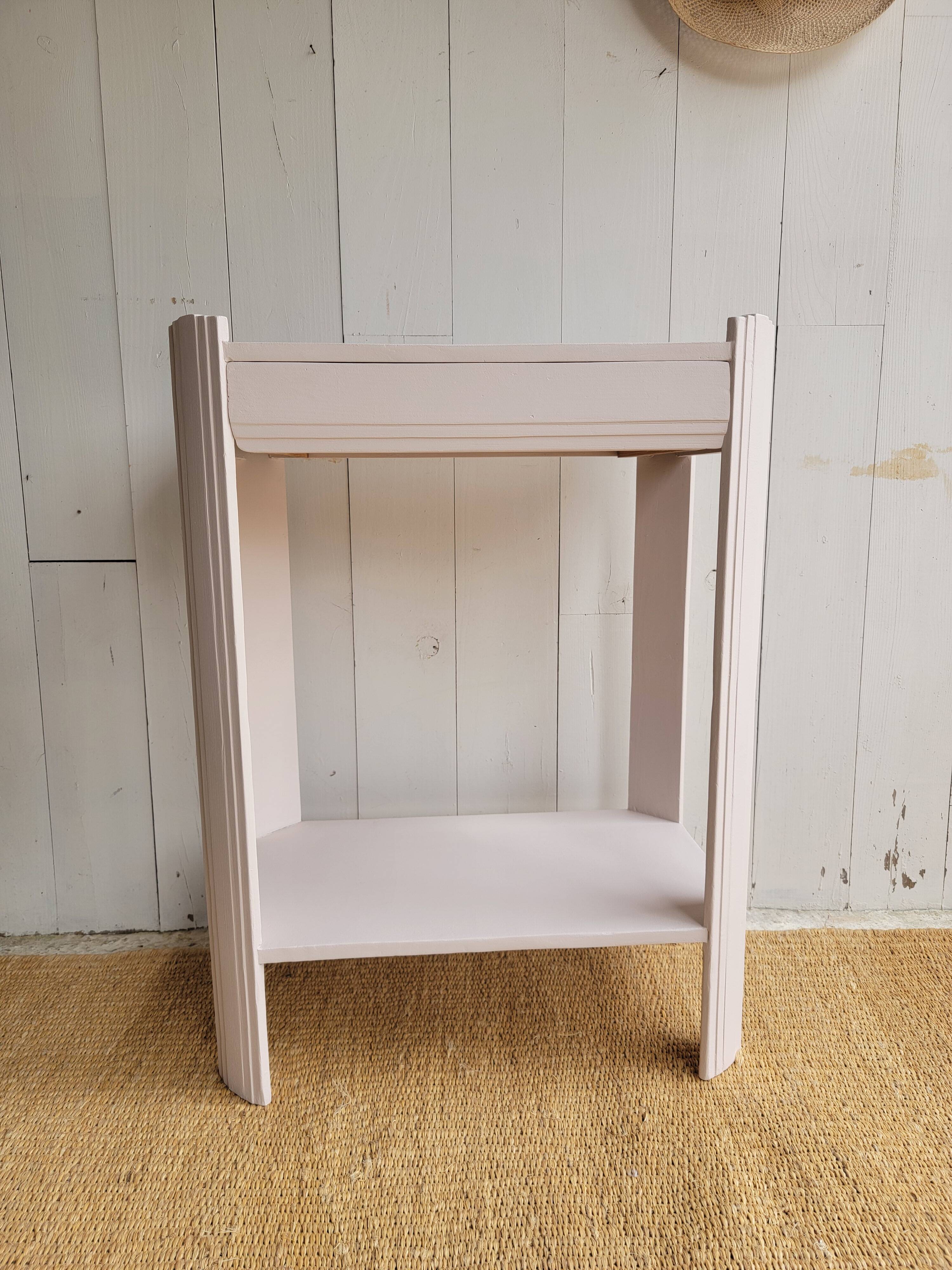 Small renovated Art Deco console in nude colour.
