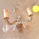 Gold wall light with tassel