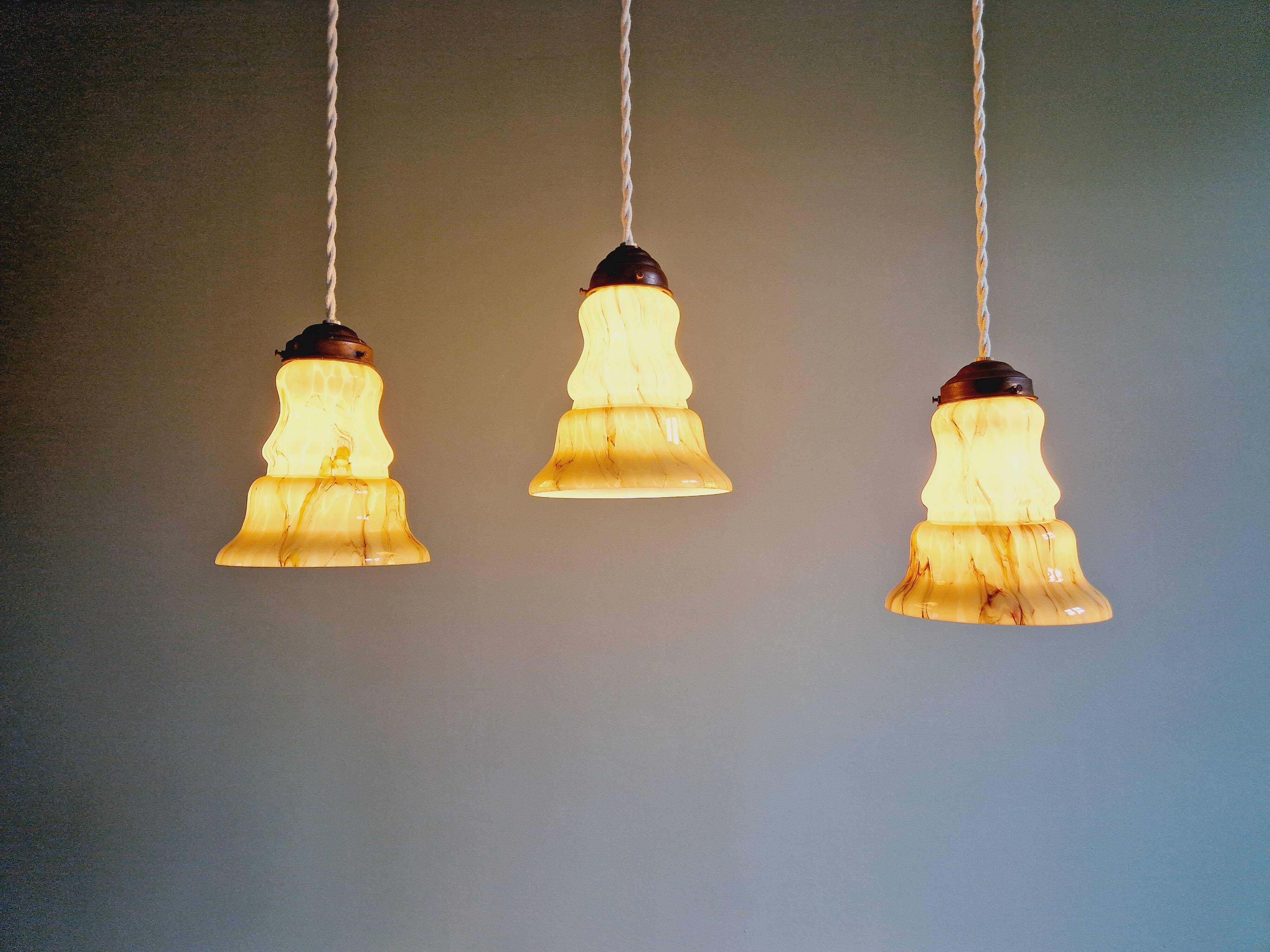 Set of 3 Art Deco marbled opaline pendant lights, 1920s-30s