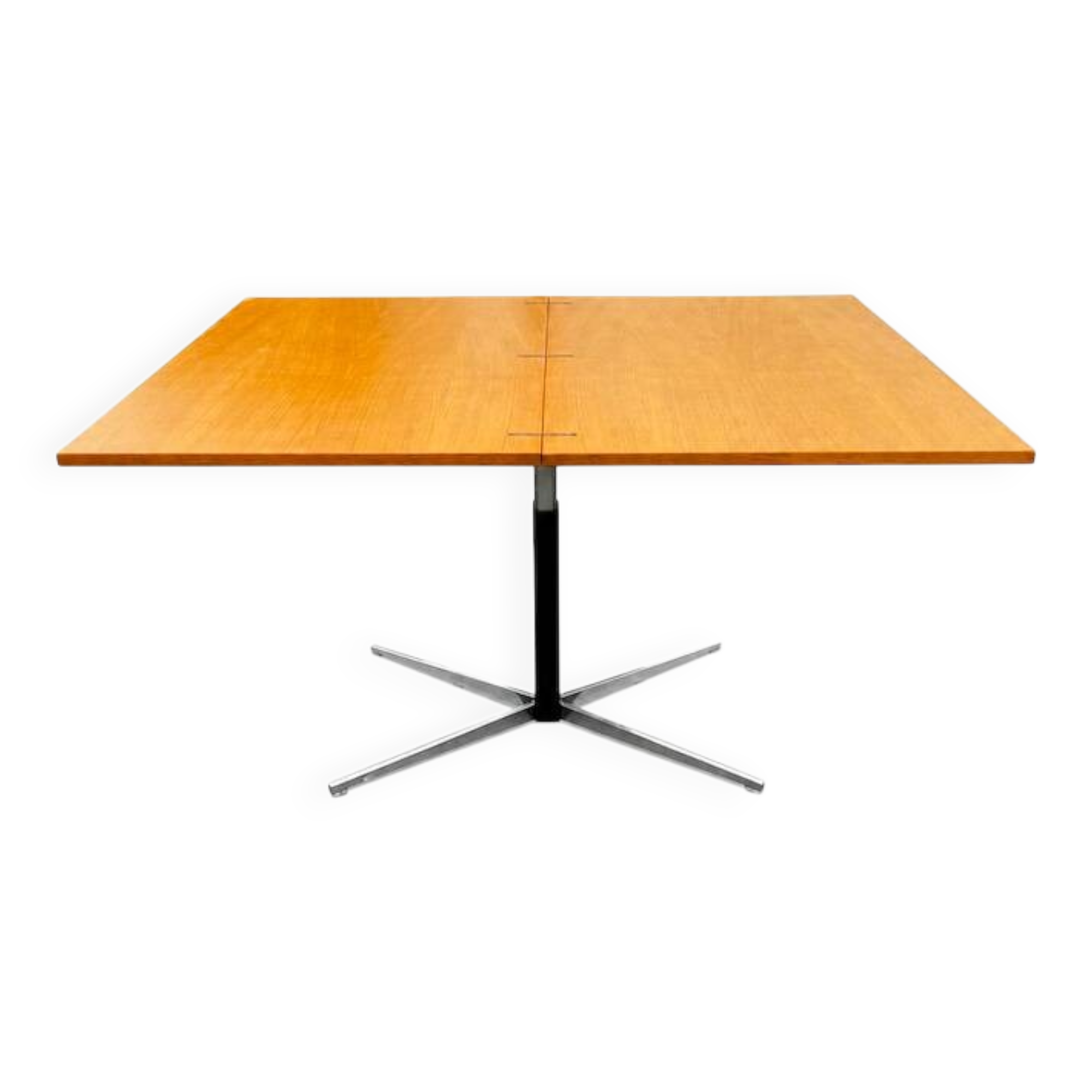 Table rises and lowers in light wood and metal.
