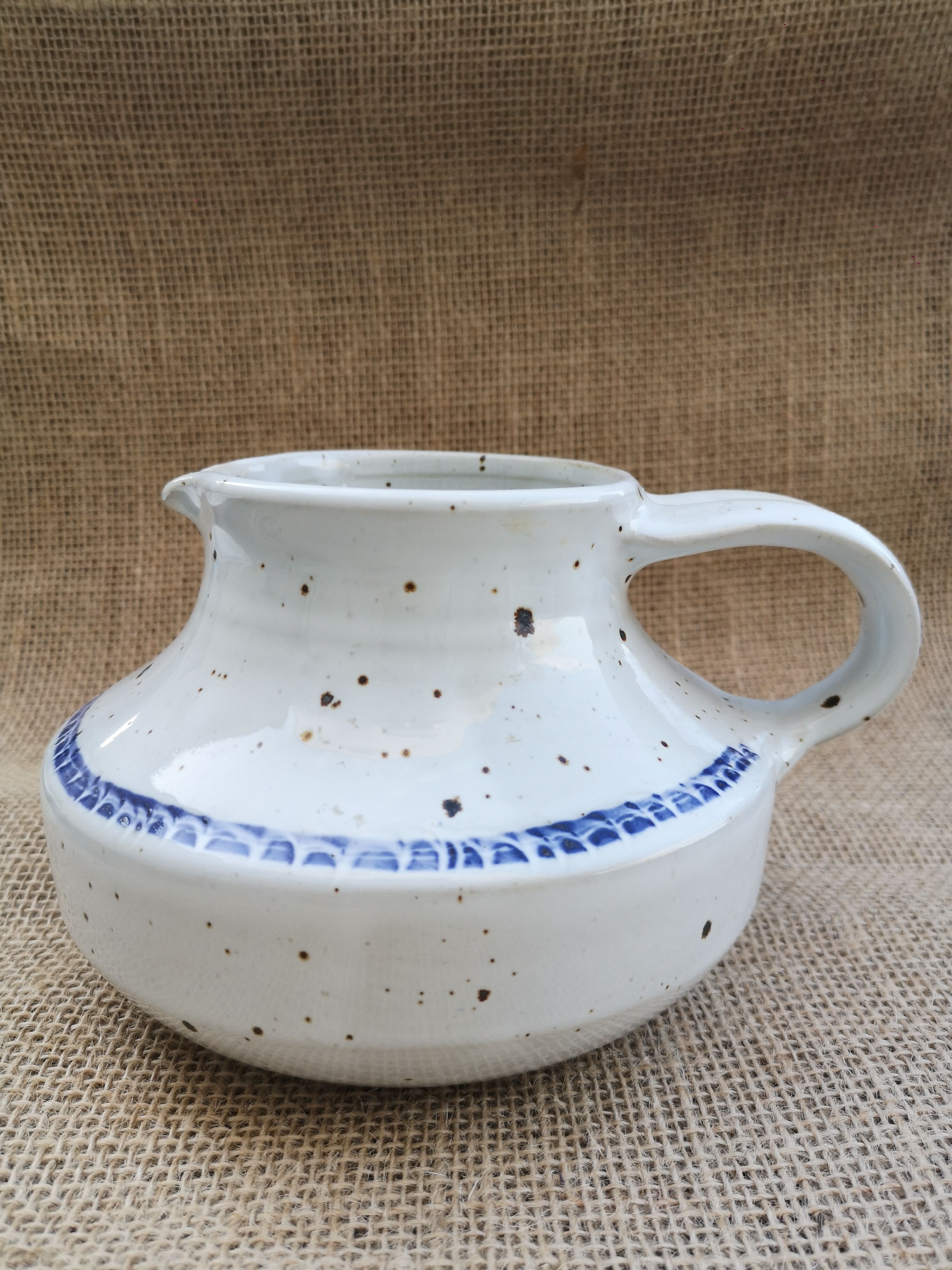 Pitcher in speckled sandstone
