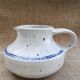 Pitcher in speckled sandstone