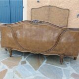 Lit with caned basket in Louis XV style.