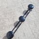 Vintage black coat rack with 3 hooks