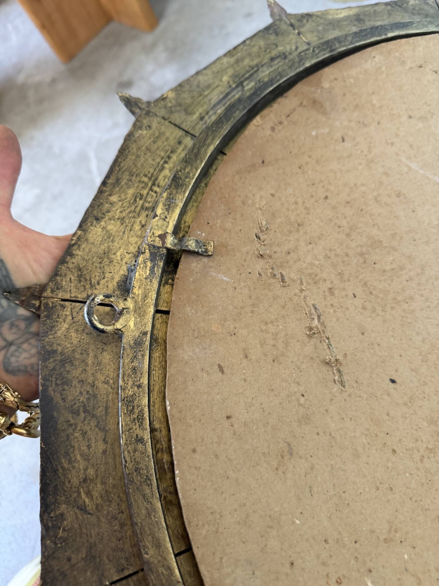 Brutalist round hammered gold metal mirror