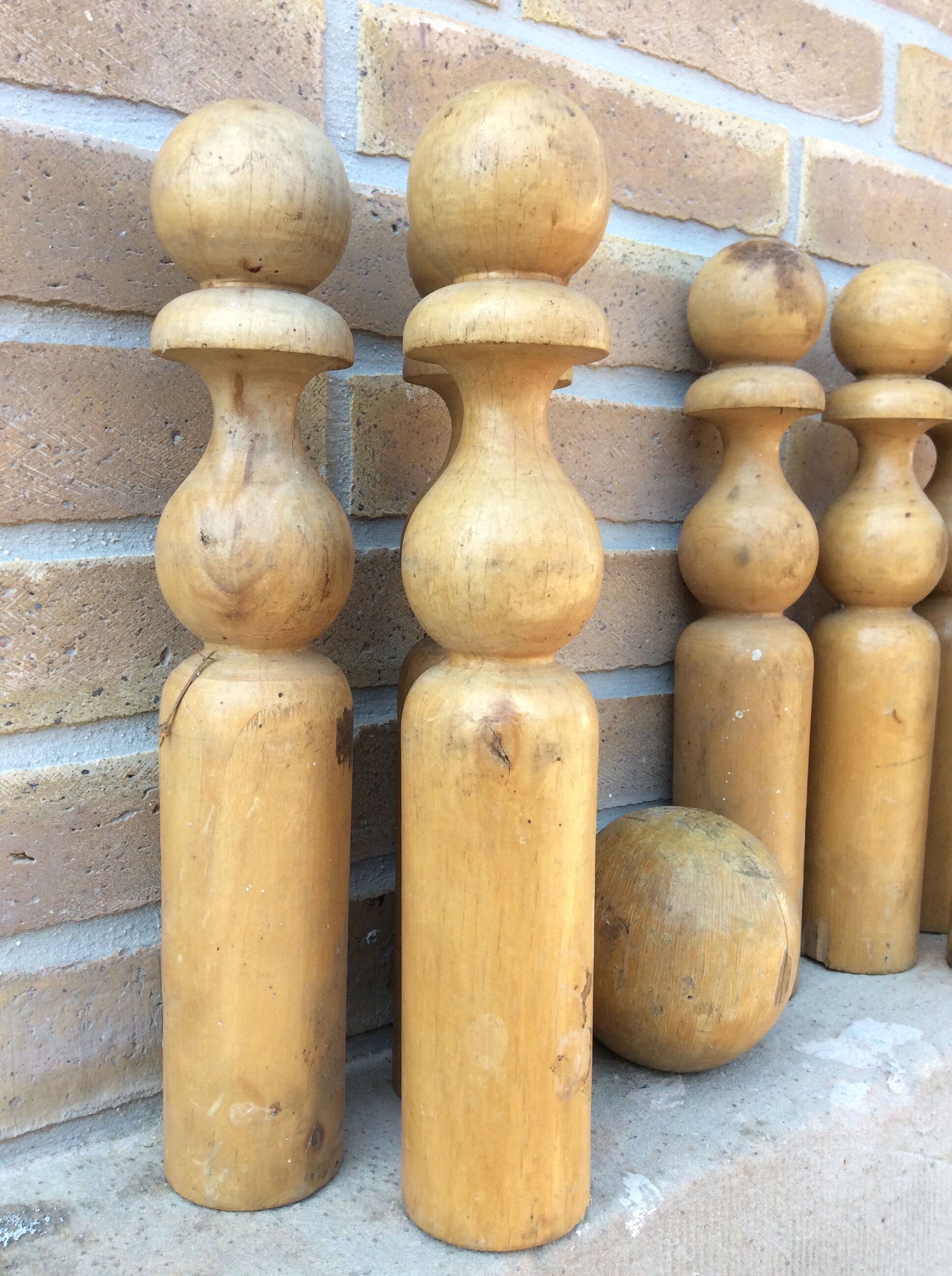 Wooden bowling and 2 vintage balls