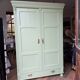 Antique painted green wooden wardrobe