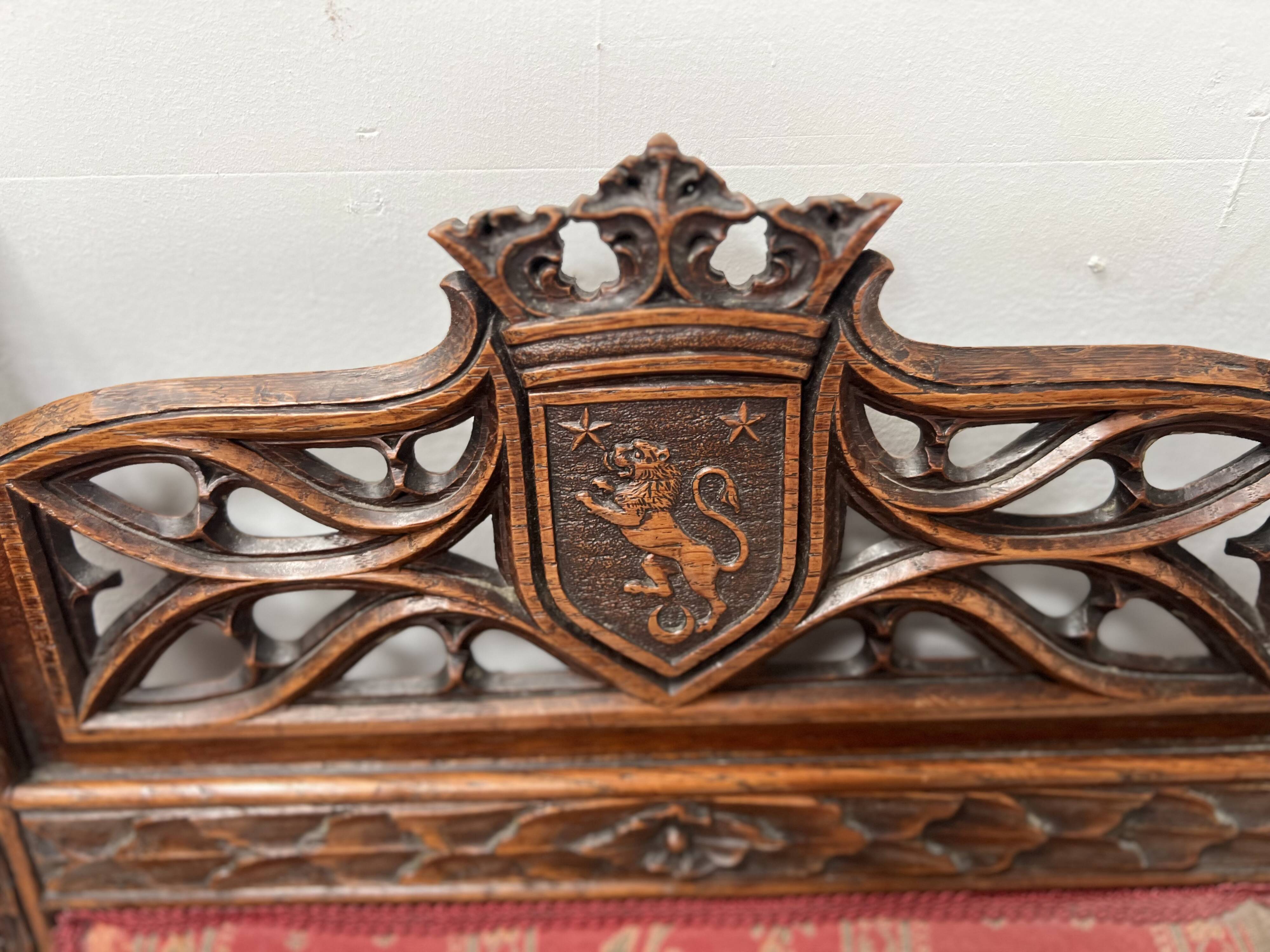 Pair of Gothic-style walnut lounge chairs, 19th century