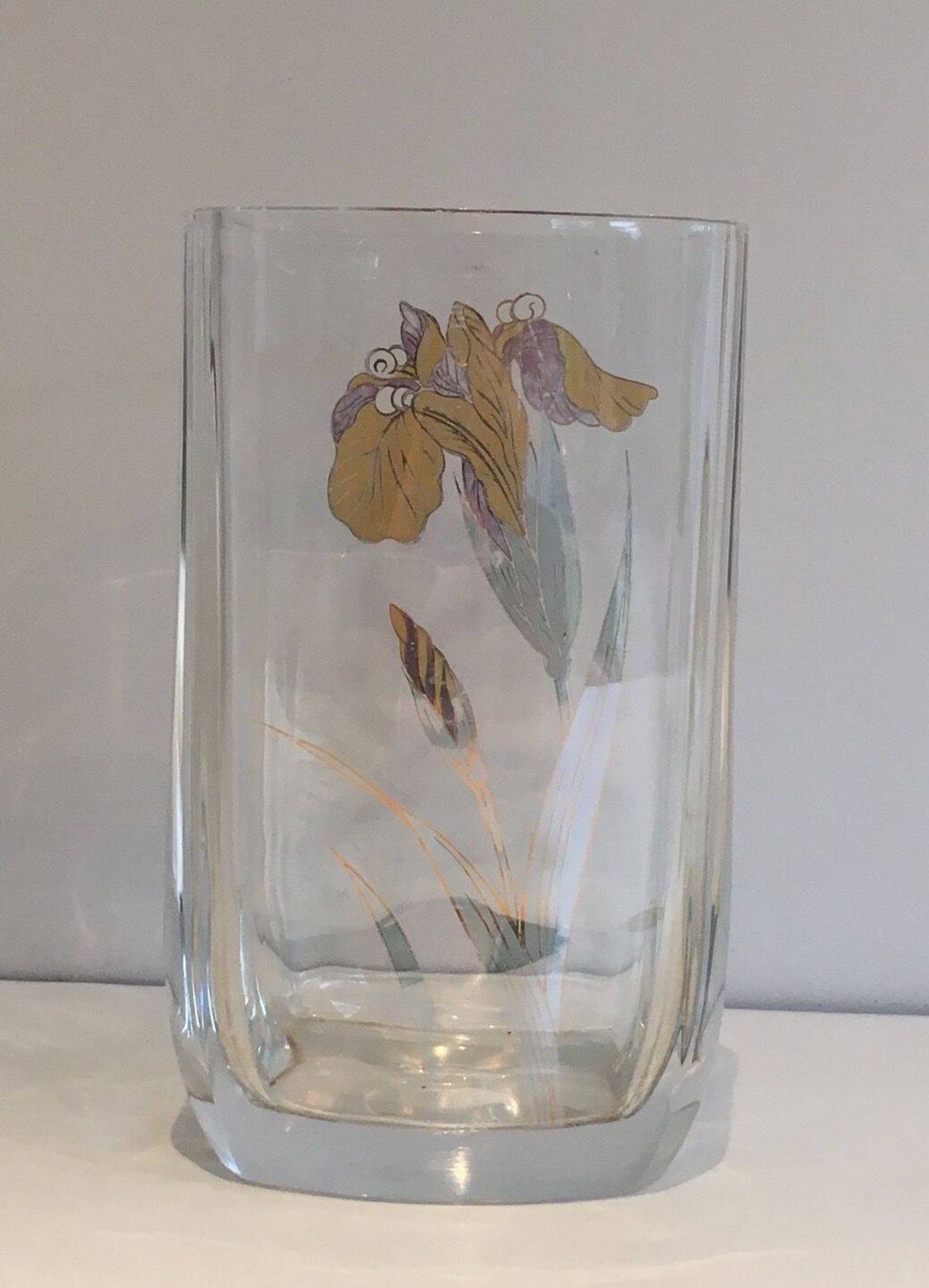 Glass vase with a decoration of a golden flower, around 1970.