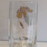 Glass vase with a decoration of a golden flower, around 1970.